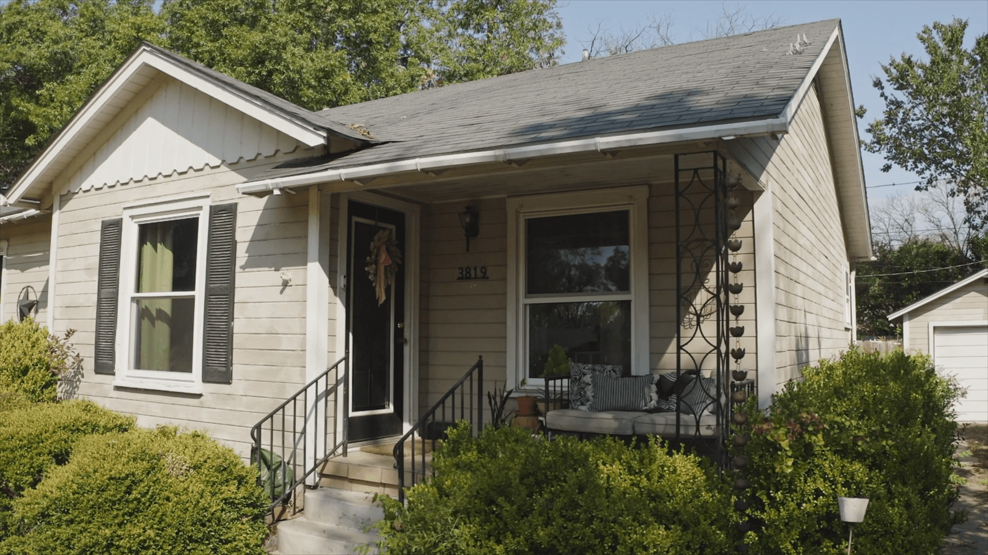 Decide to Re-side: Front of home with wood siding, showcasing cracked boards and peeling paint Front of home with wood siding, showcasing cracked boards and peeling paint